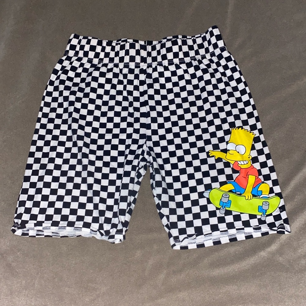 Biker shorts size large the print is checkered with Bart Simpson on skateboard.